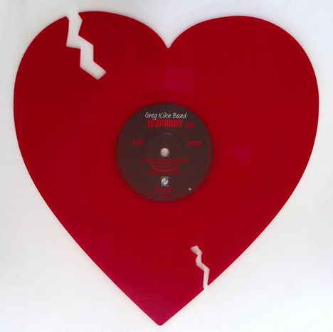 "Greg Kihn Band", "Jeopardy". Herzförmige, rote Schallplatte mit einem Zickzack-Schnitt oben und unten.