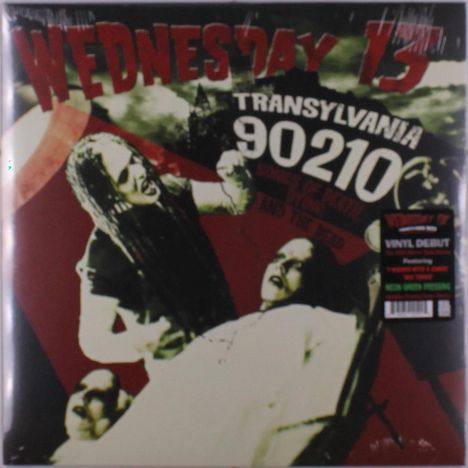 „WEDNESDAY 13“, „TRANSYLVANIA 90210“. Zwei gruselig aussehende Personen in einer düsteren Szene.
