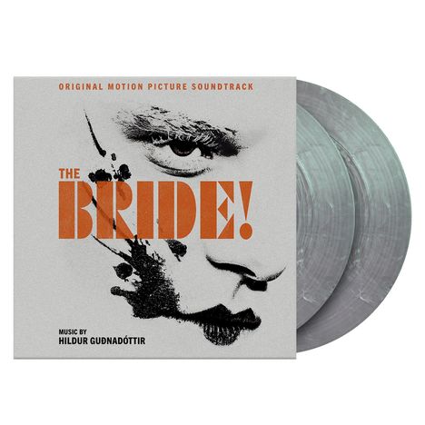 "The Bride!" in kräftigem Orange. Porträt eines Gesichts mit intensiven Augen und schwarz-weißen Texturen.