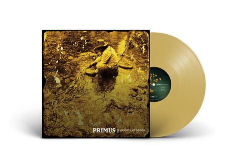 Text: "Primus A Handful of Nugs." Vinyl-Cover in Goldtönen; zeigt eine Person, die in einem Bachbett nach Gold sucht.
