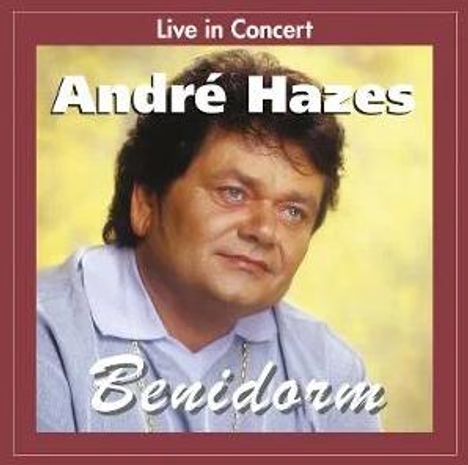 "Live in Concert André Hazes Benidorm." Ein Mann mit dunklem Haar schaut leicht zur Seite, Hintergrund in Gelbtönen.