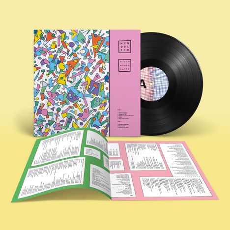 Ein schwarzes Vinyl mit einer bunten Hülle, auf der "HENGELEDDED DISCO MONOULATED" steht. Ein offenes Booklet liegt davor.
