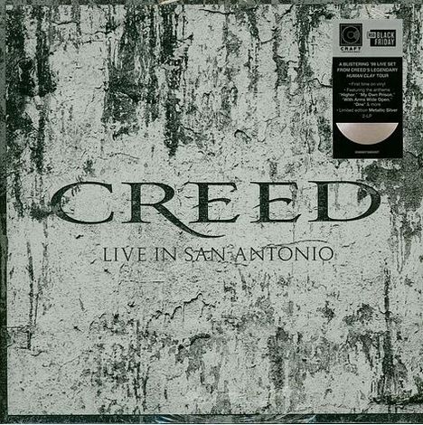 Text: "CREED LIVE IN SAN ANTONIO" auf grauem Hintergrund. Oben rechts Aufkleber mit Infos zu exklusivem Vinyl-Set.