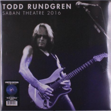 "TODD RUNDGREN SABAN THEATRE 2016" steht oben. Unten links ein Sticker, Hauptmotiv: Gitarrist mit E-Gitarre auf der Bühne.