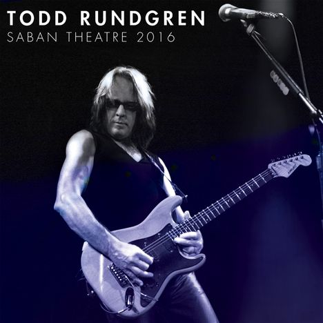 "TODD RUNDGREN SABAN THEATRE 2016" zeigt einen Mann mit Gitarre auf einer Bühne in lebhafter Pose.