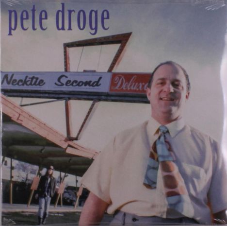 "Oberer Text: 'pete droge'. Mittig: 'Necktie Second Deluxe'. Ein Mann in Hemd und bunter Krawatte lächelt im Vordergrund."