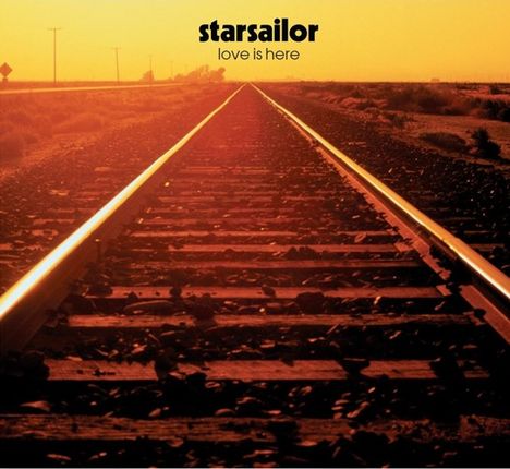 Text: "starsailor love is here". Ein Bahngleis führt in die Ferne unter einem orangefarbenen Himmel.