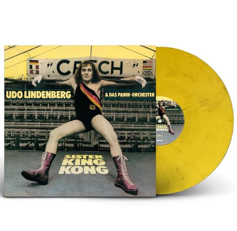 "UDO LINDENBERG & DAS PANIK-ORCHESTER" oben, "SISTER KING KONG" unten. Illustration: Person im Ring, gelbe Vinyl-Schallplatte.