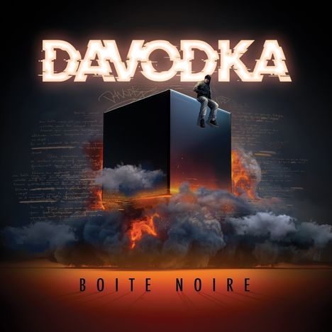 Text: "DAVODKA", "BOITE NOIRE". Illustration: Ein Mann sitzt auf einem schwarzen Würfel, umgeben von Rauch und Flammen.
