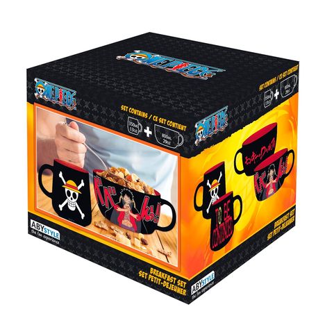 Text: "One Piece", "Set Contains", "Breakfast Set", "ABYstyle". Illustration: Tassen mit Piraten-Logo und Charakter.
