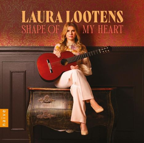 Text: "LAURA LOOTENS SHAPE OF MY HEART". Frau mit Gitarre sitzt auf antiker Kommode, elegantes Ambiente.