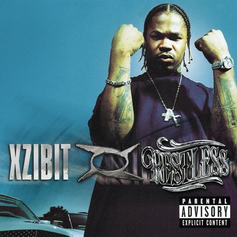 "XZIBIT - RESTLESS" und "PARENTAL ADVISORY EXPLICIT CONTENT". Ein Mann zeigt seine Muskeln, trägt Schmuck.