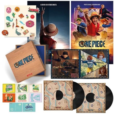 Eine Sammlung von "One Piece"-Postern, Stickern und Schallplatten. Enthält Abbildungen von Charakteren.