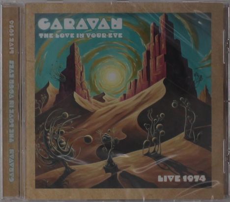 „The Love in Your Eye“, „Caravan“, „Live 1974“. Surreale Illustration mit Wüste, seltsamen Pflanzen und einem großen Sonnenmotiv.