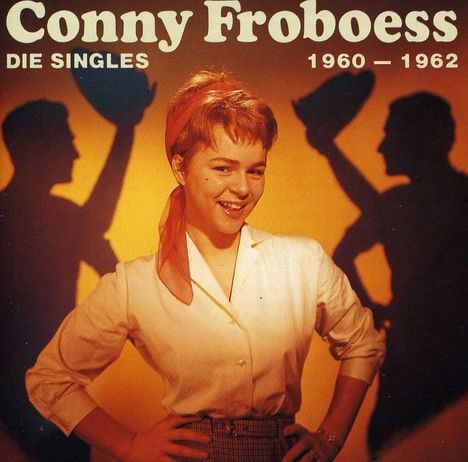 Text: "Conny Froboess - Die Singles 1960 — 1962". Frau lächelt, mit rotem Schal, vor orangefarbenem Hintergrund mit Schatten.