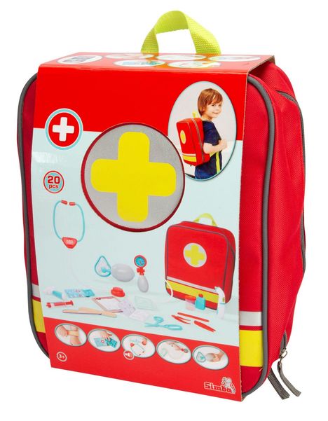 Rotes Set mit gelbem Kreuz, "20 PCS", enthält Spielzeugmedizin. Junge mit Rucksack.