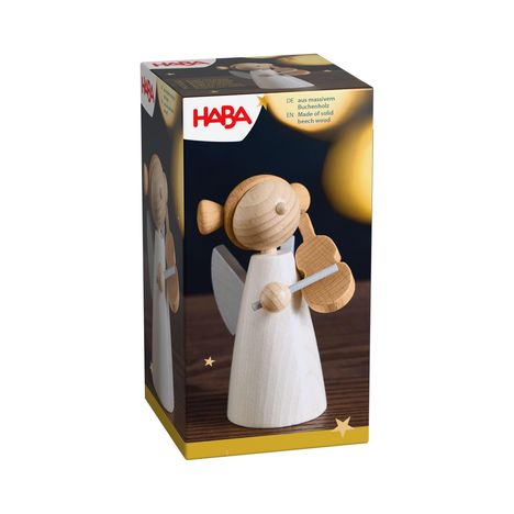 "HABA, aus massivem Buchenholz." Verpackung mit Holzengel, der eine Geige spielt. Engel im schlichten Design mit Flügeln.
