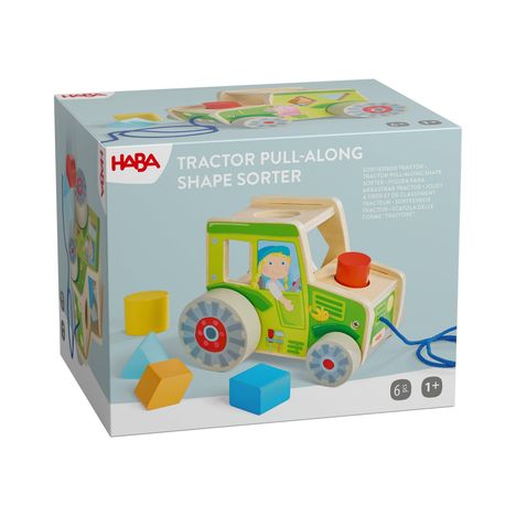 „TRACTOR PULL-ALONG SHAPE SORTER“ beschreibt ein Spielzeugtraktor mit Formensortierung; geeignet ab 1 Jahr.