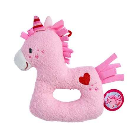 Ein weiches, rosa Plüsch-Einhorn mit einem roten Herz auf der Seite und einem kleinen Etikett mit Einhornmotiv.