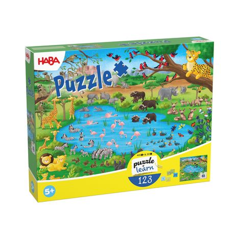 Text: "Puzzle", "puzzle + learn", "123", "48 + 20 Teile", "5+". Illustration: Tiere am Wasserloch in lebendigen Farben.