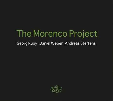 Text: "The Morenco Project. Georg Ruby, Daniel Weber, Andreas Steffens." Unten ein Logo mit "Jazzhaus Musik". Schwarzer Hintergrund.