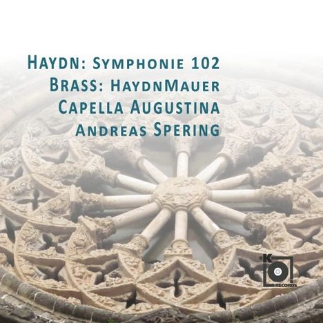 Text zu sehen: "HAYDN: Symphonie 102, Brass: haydnMauer, Capella Augustina, Andreas Spering." Hintergrund: gotische Rosette.