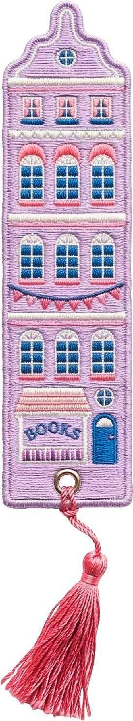 Stickerei eines Gebäudes mit Aufschrift "BOOKS", lila mit Fenstern und rosa Quaste unten.