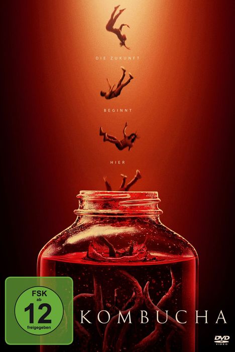 „Die Zukunft beginnt hier“ über einem großen Glas mit fallenden Menschen. Text „Kombucha“. FSK-12-Symbol vorhanden.