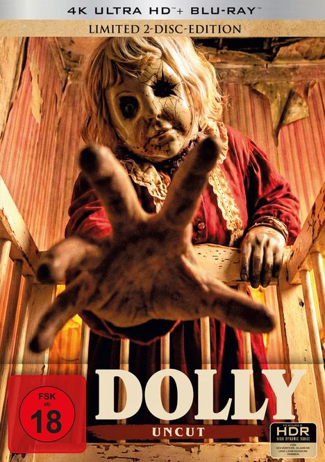 Texte: "4K ULTRA HD™ + BLU-RAY™", "LIMITED 2-DISC-EDITION", "DOLLY", "UNCUT", "FSK ab 18", "HDR". Eine Puppe mit Rissen greift aus einem Gitterbett heraus.