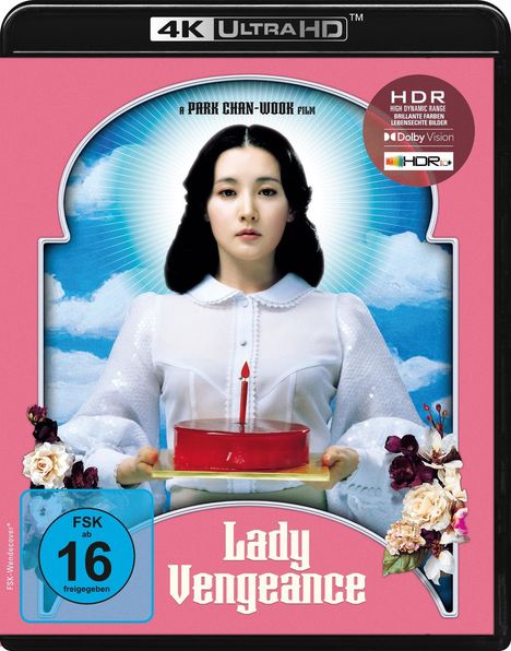 Text: "A PARK CHAN-WOOK film", "Lady Vengeance", "FSK 16". 

Frau in Weiß haltend rote Torte mit Kerze, umrahmt von Blumen.