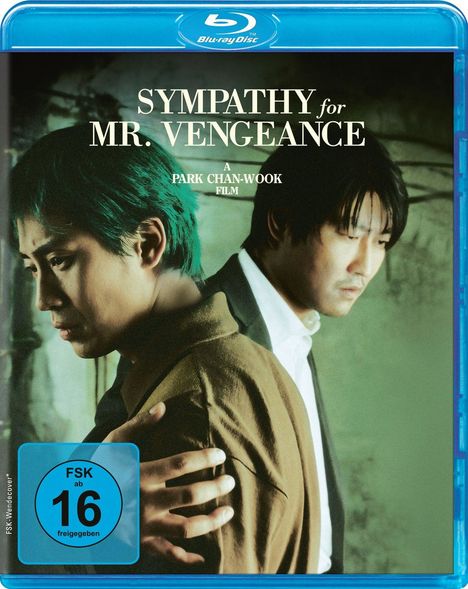 "SYMPATHY for MR. VENGEANCE" und "A PARK CHAN-WOOK FILM" stehen über zwei Männern, einer mit grünem Haar. FSK 16-Symbol unten.