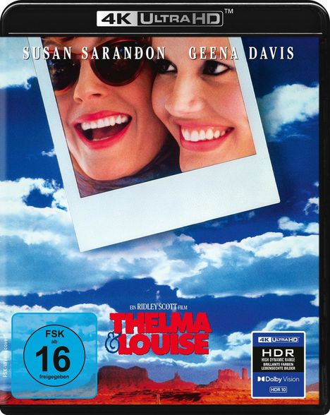 Oben stehen "SUSAN SARANDON" und "GEENA DAVIS". Unten ist "THELMA & LOUISE". Foto von zwei lachenden Frauen vor Himmel.