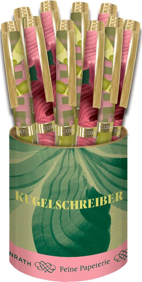 "KUGELSCHREIBER", "Feine Papeterie" steht auf einer dekorativen, grünen Halterung mit floralen Mustern, die bunte Kugelschreiber hält.