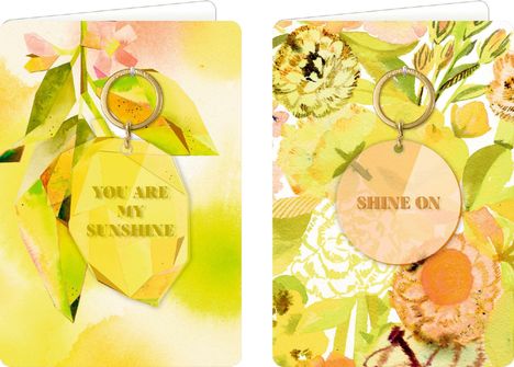 Links: "YOU ARE MY SUNSHINE" auf gelbem Kristall, rechts: "SHINE ON" auf orangefarbenem Kreis, Hintergrund floral.