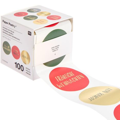 Text auf Box: "Paper Poetry, Sticker auf Rolle, 100 Stück". Aufkleber: "Fröhliche Weihnachten". Box zeigt bunte runde Aufkleber.
