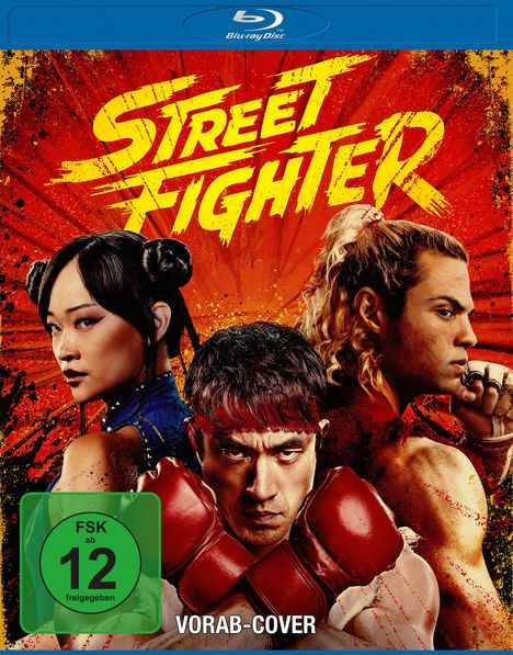 "Street Fighter" in gelber Schrift vor rotem Hintergrund, drei Kämpfer im Vordergrund, FSK 12-Symbol, Hinweis "VORAB-COVER".