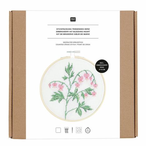 Stickpackung Tränendes Herz. Kreuzenstich-Set mit 15 cm Stickrahmen und Motiv von rosa Blumen mit grünen Blättern.