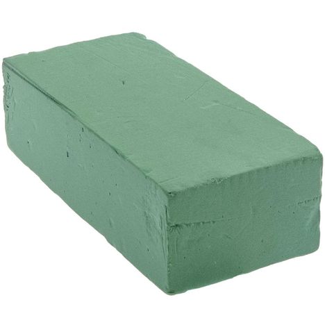 Ein rechteckiger, grüner Schaumstoffziegel, glatt und fest.