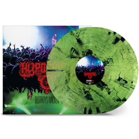 "Destroys Wacken" in dicken Buchstaben. Grüner Vinyl-Schallplatte, Konzertszene, Menschenmenge vor einer beleuchteten Bühne.