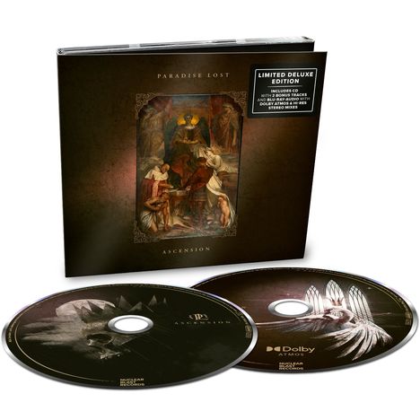 "LIMITED DELUXE EDITION", "PARADISE LOST", "ASCENSION". Zwei CDs mit grafischen Designs und einem Buch mit einem klassischen Gemälde.