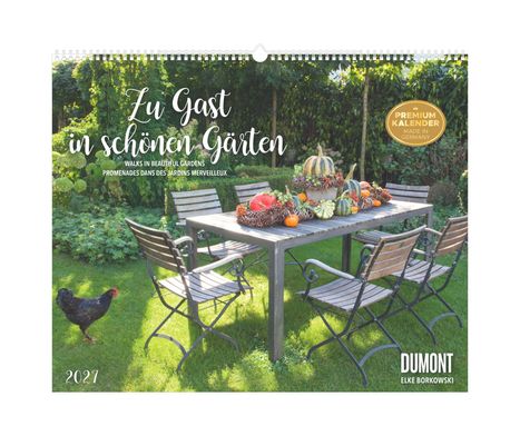 Text: „Zu Gast in schönen Gärten“, „Premium Kalender“, „2027“. Tisch mit Kürbissen im Garten, Huhn läuft seitlich.