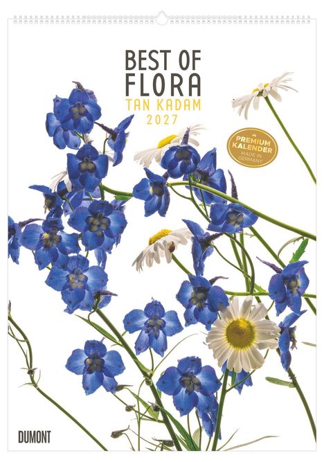 Oben steht "BEST OF FLORA TAN KADAM 2027". Unten rechts ein goldener Sticker "PREMIUM KALENDER MADE IN GERMANY". Blau-weiße Blumen.