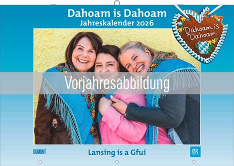 Text im Bild: "Dahoam is Dahoam", "Jahreskalender 2026", "Vorjahresabbildung", "Lansing is a Gfui". Drei lachende Personen.