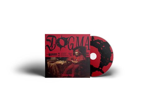 Text: "DOGMA". Illustration: Ein Mann in rotem Gewand sitzt nachdenklich auf einem Stuhl. CD mit ähnlichem Design.