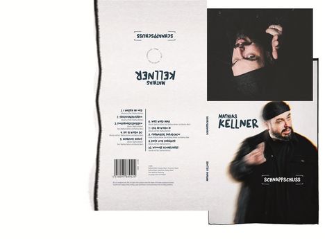 Cover mit "MATHIAS KELLNER", Titel "SCHNAPPSCHUSS". Dunkel gekleideter Mann mit Mütze und Bart, bewegt die Hände.