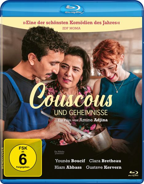 Texte: "Eine der schönsten Komödien des Jahres" ZDF MOMA. "Couscous und Geheimnisse". Drei Personen, lachend, umarmen sich.
