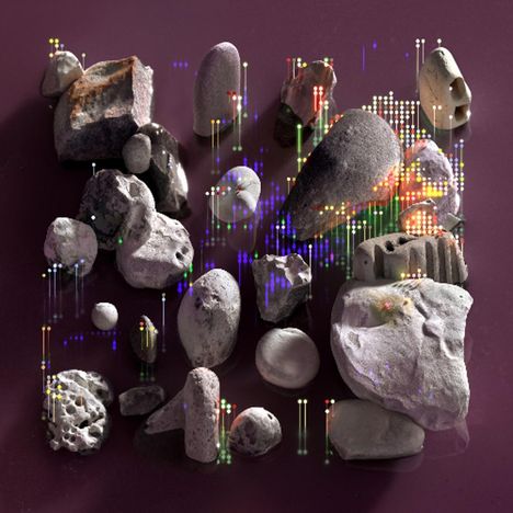 Steine unterschiedlicher Formen liegen auf einer violetten Fläche, verziert mit bunten, vertikalen Lichtpunkten.