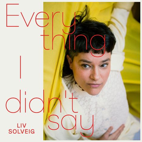 Text: "Everything I didn't say" und "Liv Solveig". 
Eine Person liegt auf gelbem Stoff, schaut nach oben.