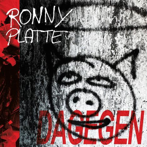 Text: "RONNY PLATTE DAGEGEN". Graffiti eines Schweins auf grauer Wand, mit rotem und schwarzem Hintergrund.