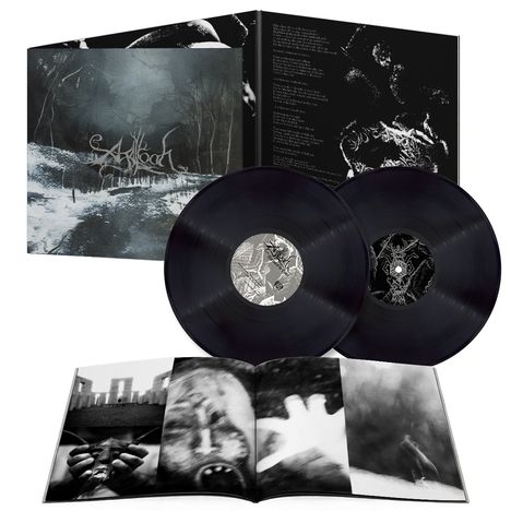 Text auf dem Albumcover: "Abaoth". Zwei Schallplatten und ein Booklet mit düsteren Bildern liegen daneben.